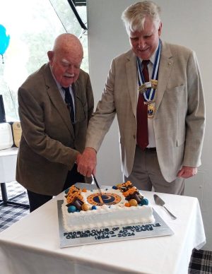 8. Member Arthur Coleman & President cutting cake_resized